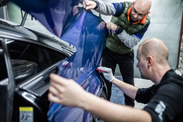 Car,Wrapping,Specialists,Putting,Vinyl,Foil,Or,Film,On,Car.